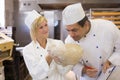 Baker smelling bread dough