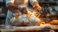Baker Sprinkling Sugar on a Loaf of Bread