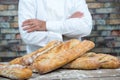 Baker with traditional bread french baguettes Royalty Free Stock Photo