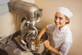 Baker using large mixer to mix dough