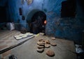 A baker at work in ancient Medina of Fez in Morocco