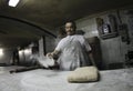 Baker at work on antique bakery 014