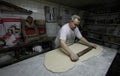 Baker at work on antique bakery 007