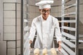 Latino man in chef\'s uniform working in a bakery. Royalty Free Stock Photo