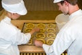 Bakers in bakery producing pretzels