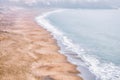 Bakers Beach aerial view over Californian sandy beach near San Francisco Bay, Pacific Ocean, gorgeous seascape in light mist,