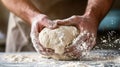 Bakers hands kneading dough for artisan bread