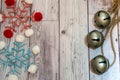 Bakers twine fabric snowflakes and large jingle bells flatlay on Royalty Free Stock Photo