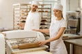 bakers using industrial dough roller