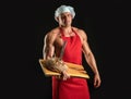 Bakery advertising. Cooking and baking. Chef baker man in apron. Sexy guy with bread and knife. Royalty Free Stock Photo
