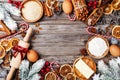 Bakery background with ingredients for cooking christmas baking decorated with fir tree. Flour, brown sugar, eggs and spices. Royalty Free Stock Photo