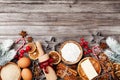 Bakery background with ingredients for cooking christmas baking decorated with fir tree. Flour, brown sugar, eggs and spices. Royalty Free Stock Photo