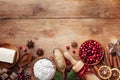 Bakery background with ingredients for cooking Christmas baking. Flour, brown sugar, butter, cranberry and spices on wooden table Royalty Free Stock Photo