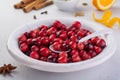 Bakery background with ingredients for cooking Christmas baking. Flour, brown sugar, cranberry and spices top view Royalty Free Stock Photo