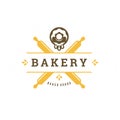 Bakery badge or label retro vector illustration rolling pins and donut silhouettes for bakehouse.