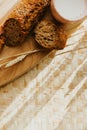 Bakery baker bread and milk. Fresh homemade bread on a table in the kitchen, organic breakfast Royalty Free Stock Photo