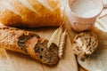 Bakery baker bread and milk. Fresh homemade bread on a table in the kitchen, organic breakfast Royalty Free Stock Photo