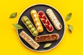 Bakery banner background of eclairs colorful topping