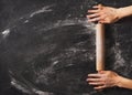 Bakery black background with roll and famale hands flat lay