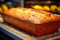 Bakery bliss, homemade banana bread on a steel baking tray board