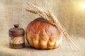 Bakery Bread and Sheaf of Wheat Ears. Still-life Royalty Free Stock Photo