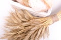 Bakery Bread with sheaf of Wheat Ears on white Royalty Free Stock Photo