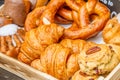 Bakery Bread on a Wooden Table. Various Bread and Sheaf of Wheat Royalty Free Stock Photo