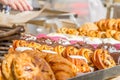 Bakery Bread on a Wooden Table. Various Bread and Sheaf of Wheat Royalty Free Stock Photo