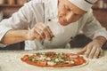 Bakery chef cooking bake in the kitchen professional Royalty Free Stock Photo