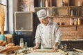 Bakery chef cooking bake in the kitchen professional Royalty Free Stock Photo