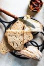 Bakery, crusty loaves of bread. Still life captured from above top view, flat lay . sun-dried tomatoes. Vegetarian food