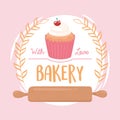 Bakery cupcake and rolling pin emblem design icon