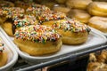 Bakery display case with freshly made doughnuts Royalty Free Stock Photo