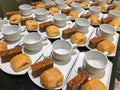 bakery and empty cup of coffee ready for serve in meeting room Royalty Free Stock Photo