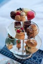 Bakery food and sandwiches on a three tier stand