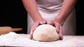 In the bakery, the hands of the baker are seen very closely as he prepares various flour products in an apron, after which he lays Royalty Free Stock Photo