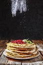 Bakery or homemade cuisine. Homemade pancakes closeup on a wooden table. Rustic style, Russian pancakes, Shrovetide, Mardi Gras