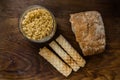 Bakery ingredients - bread, wafer rolls, pasta on wood table. Sweet pastry baking concept. Flat lay, copy space, top view.