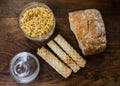 Bakery ingredients - bread, wafer rolls, pasta on wood table. Sweet pastry baking concept. Flat lay, copy space, top view.