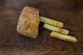 Bakery ingredients - bread, wafer rolls on wood table. Sweet pastry baking concept. Flat lay, copy space, top view. Royalty Free Stock Photo