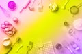 Bakery ingredients over rainbow gradient background - butter, sugar, flour, eggs, oil, spoon. Baking frame, cooking concept in