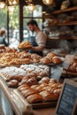 bakery item display, A captivating bakery item display featuring an array of artisan breads and pastries. The setting is a Royalty Free Stock Photo