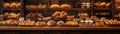bakery item display, A captivating bakery item display featuring an array of artisan breads and pastries. The setting is a Royalty Free Stock Photo