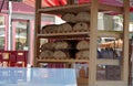 A bakery market stall with homemade loaves of breads arranged in the shelves on Saturday market in Freiburg im Breisgau on Cathedr Royalty Free Stock Photo