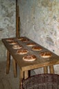 Bakery in medieval castle kitchen and breads on table Royalty Free Stock Photo