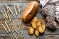 Bakery set with fresh wheaten bread on table rystic background top view