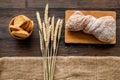 Bakery set with fresh wheaten bread on table rystic background top view