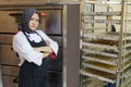 Bakery shop owner female muslim chef