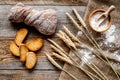 Bakery set with fresh wheaten bread on table rystic background top view