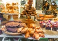 Bakery showcase with croissant, cake, cookies. Paris, France